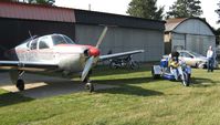 N2772V @ OH36 - Art Moose - his trike and Bonanza. He's bordering on having too much fun. - by Bob Simmermon