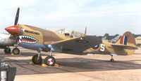 N1009N @ EGUL - P-40N Warhawk in RAF markings - by Simon Palmer