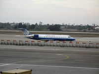 N986SW @ LAX - United Express CL-600-2B19 in new colors taxying @ LAX - by Steve Nation