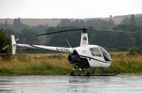 G-CTRL @ EGBN - Robinson R22 Beta at a wet Tollerton airfield - by Terry Fletcher