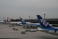 JA611A @ NRT - Tail section together with JA615A in NRT - by Holger Lange
