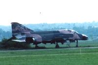 64-0763 @ FFO - F-4C sitting at the infield IR range on Wright Field behind the National Museum of the U.S. Air Force.  Shot required a 600mm lens with 2x tele-converter.  Rainy day. - by Glenn E. Chatfield