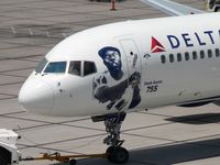 N627DL @ PHX - Nose art depicting Hank Aaron of the Atlanta Braves, who scored 755 home runs during his career. - by John Meneely