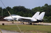161611 @ NPA - F-14 at the National Museum of Naval Aviation.  Parked way out past the display birds; photo taken with 310mm lens from moving bus - by Glenn E. Chatfield
