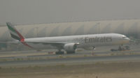 UNKNOWN @ OMDB - Emirates Boeing 777-300 under tow at Dubai - by John J. Boling