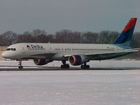 N641DL @ PVD - N641DL getting ready to head south to Atlanta from Providence after a midwinter snowfall - by Geoff Cook