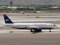N621AW @ PHX - Taxiing to the runway - by John Meneely