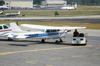 N141PF @ PDK - Linecrew staying in the shade! - by Michael Martin