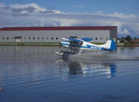 N4427B @ LHD - 1955 Cessna 170B, Continental C145 145 Hp, fast lake taxi after landing - by Doug Robertson