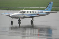D-ICBB @ LOWK - just arrived in heavy rain... - by Wolfgang Kronfuss