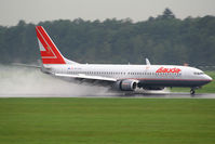 OE-LNS @ LOWG - maximum reverse on wet runway! - by Wolfgang Kronfuss