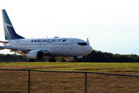 C-FWSX @ YKF - Taixing to runway 25, Flight to Calgary - by ShawnH