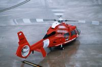 6559 @ CID - HH-65B below the control tower - a quick stop in and out