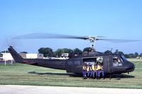 64-13885 @ DPA - UH-1H with Navy parachute team.  This Huey saw combat in Vietnam. - by Glenn E. Chatfield