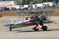 N450SR @ RAL - Silver Wings Stearman B75N1 N450SR taxiing to RWY 27 for takeoff.  Pilot is Hartley Folstad and the wing walker is Margaret Stivers. - by Dean Heald