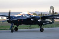N909TC @ VNY - Grumman F7F-3P Tigercat NX909TC taxiing to RWY 16R after making a full stop landing during a pattern work session. - by Dean Heald