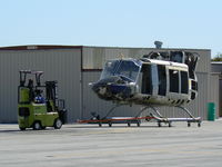 UNKNOWN @ GPM - Bell 205 type headed for a rebuild....I hope - by Zane Adams