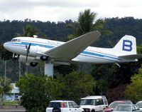 N5590C @ YBCS - unmarked Douglas DC3 on a pole at centre of Cairns Airport - by Terry Fletcher