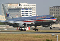 N363AA @ KLAX - touching down on rwy 24R. - by Philippe Bleus