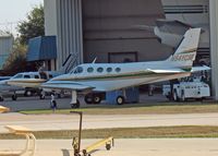 N541CM @ ADS - 1974 Cessna 340, c/n 340-0338, Parked at Addison.  Looks like a Boeing Business Jet in the background - by Timothy Aanerud