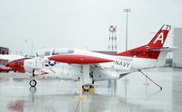 158575 @ ORD - T-2C at the AFR/ANG open house, in heavy rain - by Glenn E. Chatfield