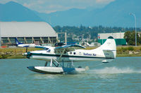 C-FITS @ CYVR - landing at the YVR seaplane facility. - by metricbolt
