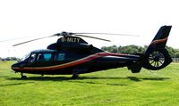 G-MLTY - Helicopters arrive at the temporary Heliport on 2007 Epsom Derby Day (Horse racing) - by Terry Fletcher