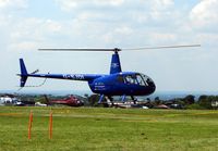 G-SJDI - Helicopters arrive at the temporary Heliport on 2007 Epsom Derby Day (Horse racing) - by Terry Fletcher