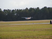 N1180M @ KCRG - Me landing the Flying Weaners C172K at Craig. - by ryanburnette