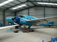 G-AHKX @ EGTH - Avro Anson undergoing some maintenance while on display at Old Warden Aerodrome - by BTBFlyboy