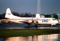 N669F @ EGGW - EMS's Lockheed Electra sits in the Luton early morning sunlight in 1989 - by Terry Fletcher