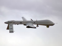 99-3061 @ KLSV - USAF - Air Force / The MQ-1 Predator is a system, not just an aircraft. A fully operational system consists of four aircraft (with sensors), a ground control station, a Predator Primary Satellite Link, and approximately 55 personnel for deployed 24-hour o - by Brad Campbell