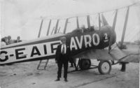 G-EAIF @ SOUTHPORT - MY FATHER STANDING ALONGSIDE G-EAIF AVRO- J.C. WHALLEY - by UNKNOWN