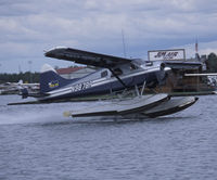 N9878R @ LHD - Take off at Lake Hood Seaplane Base - by J.G. Handelman