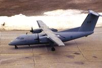 142801 @ CID - RCAF DeHavilland Dash 8 142801 taxiing by the tower.  Film got hot and left brown haze.