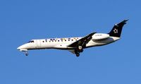 G-RJXK @ EGCC - BMI Embraer in Star Alliance colours about to land at Manchester - by Terry Fletcher