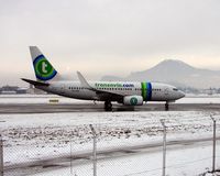 PH-XRZ @ LOWS - Transavia B737-700 taxies to the hold at Salzburg on a very icy morning - by Terry Fletcher