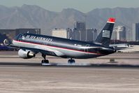 N124US @ LAS - US Airways N124US landing on RWY 25L. - by Dean Heald