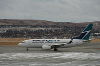 C-GUWS @ CYYC - Boeing 737-700 - by Mark Pasqualino