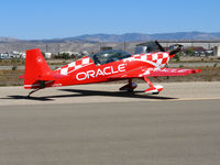 N772TA @ KIC - Brightly painted (Team) ORACLE 2006 Extra Flugzeugbau Gmbh EA 300/L taxying @ Mesa del Rey (King City) Airport, CA - by Steve Nation
