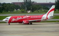 HS-AAJ @ VTBD - Air Asia B737 taxies out at Bangkok Don Muang , the only airport I know of that has a golf course seperating the two runways !! - by Terry Fletcher