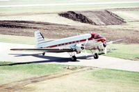 N47CE @ DPA - taxiing by the control tower - by Glenn E. Chatfield