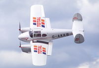 G-AKKB @ EGBP - Miles Gemini flying over Kemble airfield, UK - by Henk van Capelle