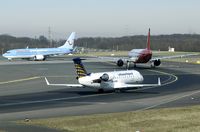 D-ACRB @ EDDL - This CL-600 awaits his turn for take off behind an Air Berlin A320 and Hapag Lloyd 737.