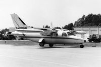 N488GB @ DPA - Photo taken for aircraft recognition training.  Mitsubishi MU-2 in front of the control tower taxiing in. - by Glenn E. Chatfield