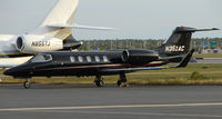 N351AC @ RSW - Sleek looking black Lear 31 - by Terry Fletcher