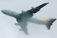 DQ-FJK @ AKL - Disappearing in the rain clouds... - by Micha Lueck