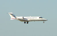 XA-BFX @ MIA - Mexican registered Lear 45 about to land at Miami - by Terry Fletcher