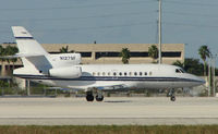 N127SF @ MIA - Falcon 900EX about to depart Miami in the mid-afternoon heat