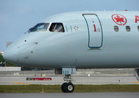 C-FMZD @ FLL - The pilot of this Air Canada EMB190 looks a bit bemused by all the attention from the photographers - by Terry Fletcher
